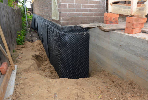 Happy homeowners after waterproofing job in Neshkoro